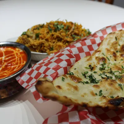 Tanjore combo with butter chicken, biryani and garlic naan
